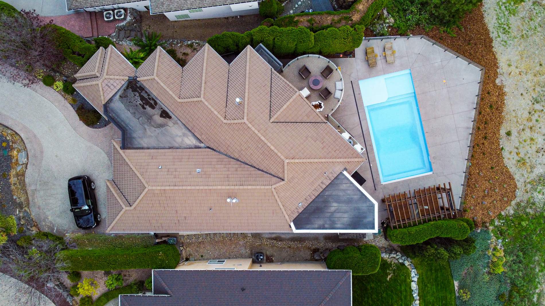 concrete driveway and pool deck from drone view